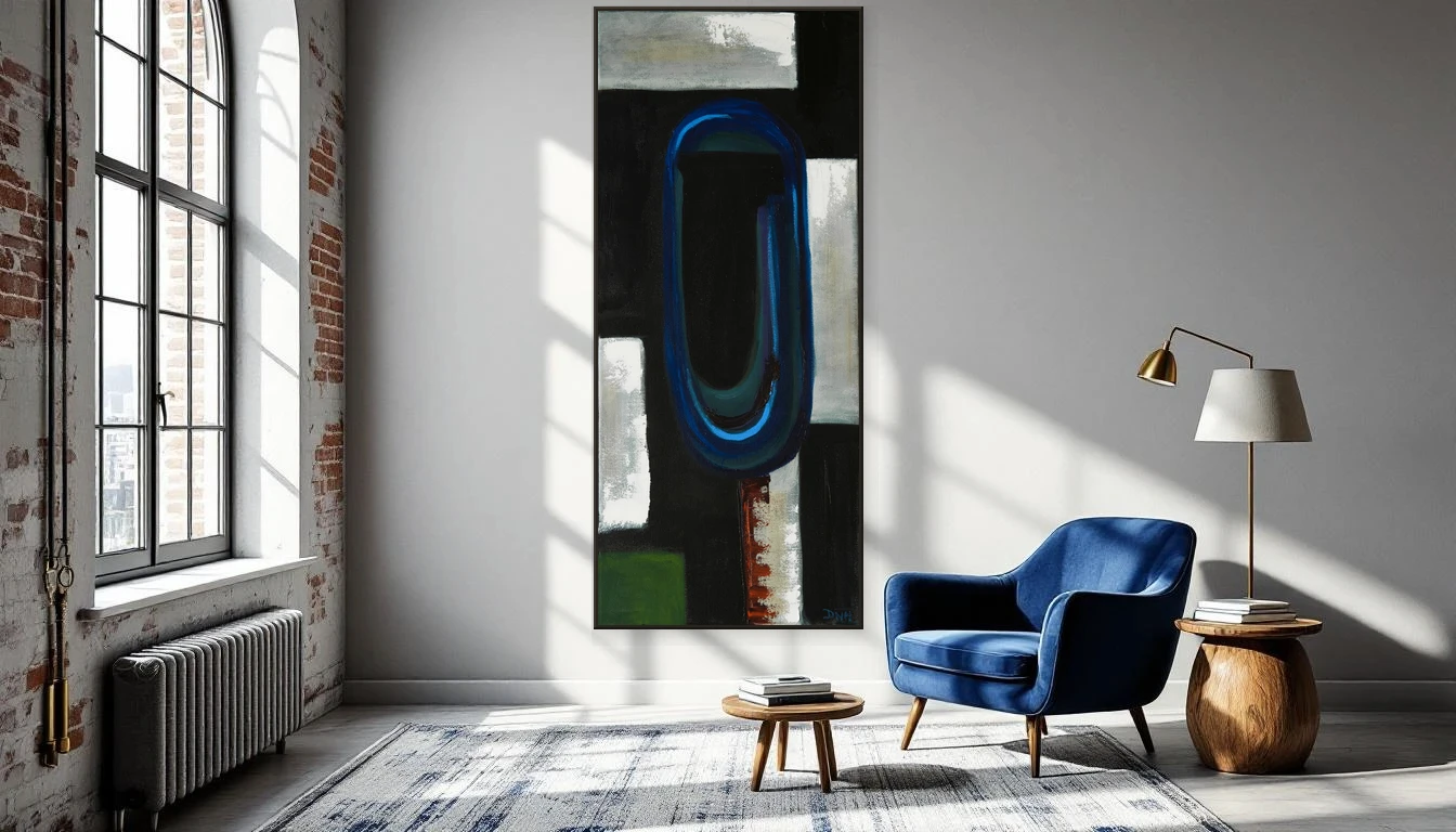 Reading nook with deep blue velvet chair and natural light on an empty wall